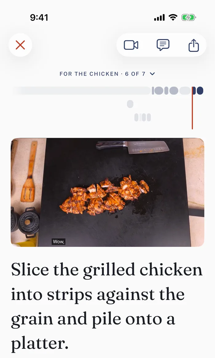 Step six of seven for Sam the Cooking Guy's grilled chicken, slice it into strips against the grain and pile it onto a platter, with his video at the moment the sliced chicken is on the board.